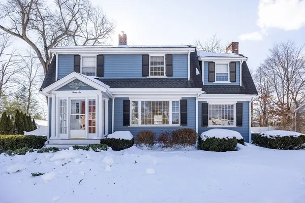 a front view of a house with garden