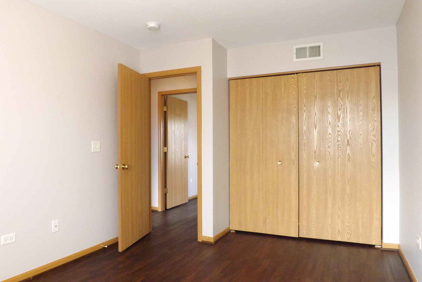 1865 Cattail Circle Aurora, IL 60504 - Photo 13 of 14 a view of an empty room with wooden floor and closet