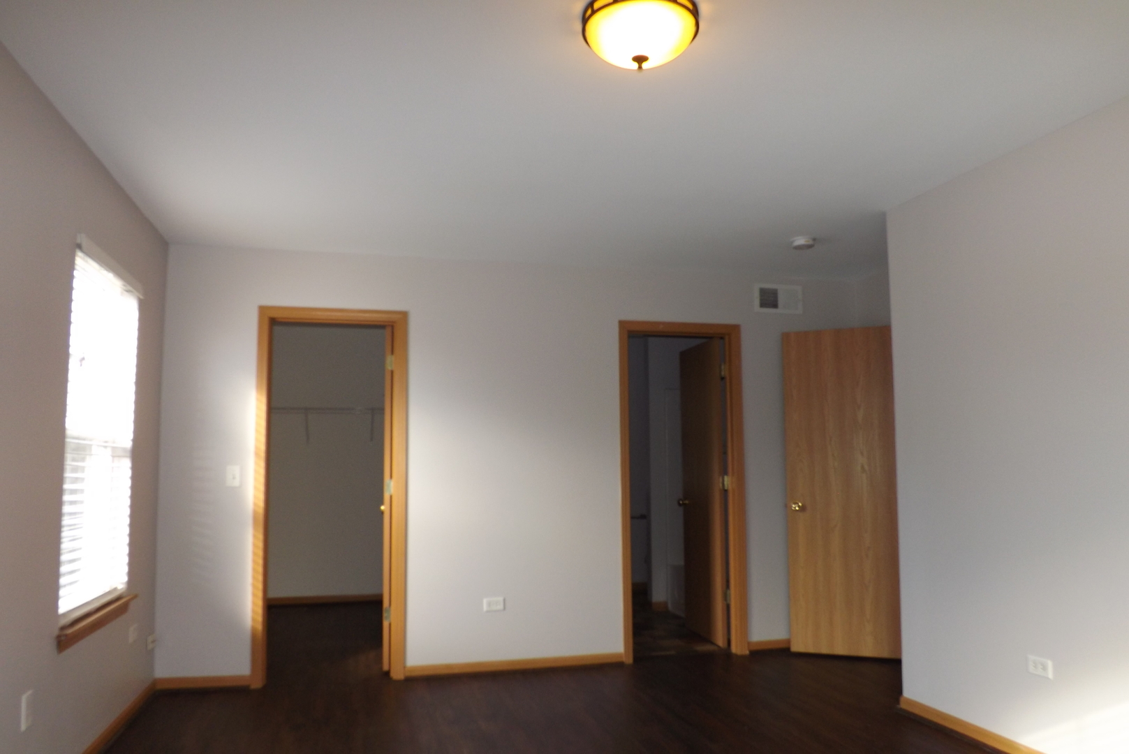 1865 Cattail Circle Aurora, IL 60504 - Photo 10 of 14 an empty room with wooden floor and windows