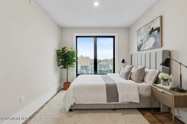 a bedroom with a bed potted plant and a window