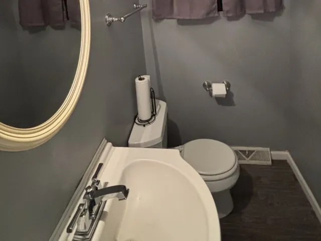 a bathroom with a toilet and a sink