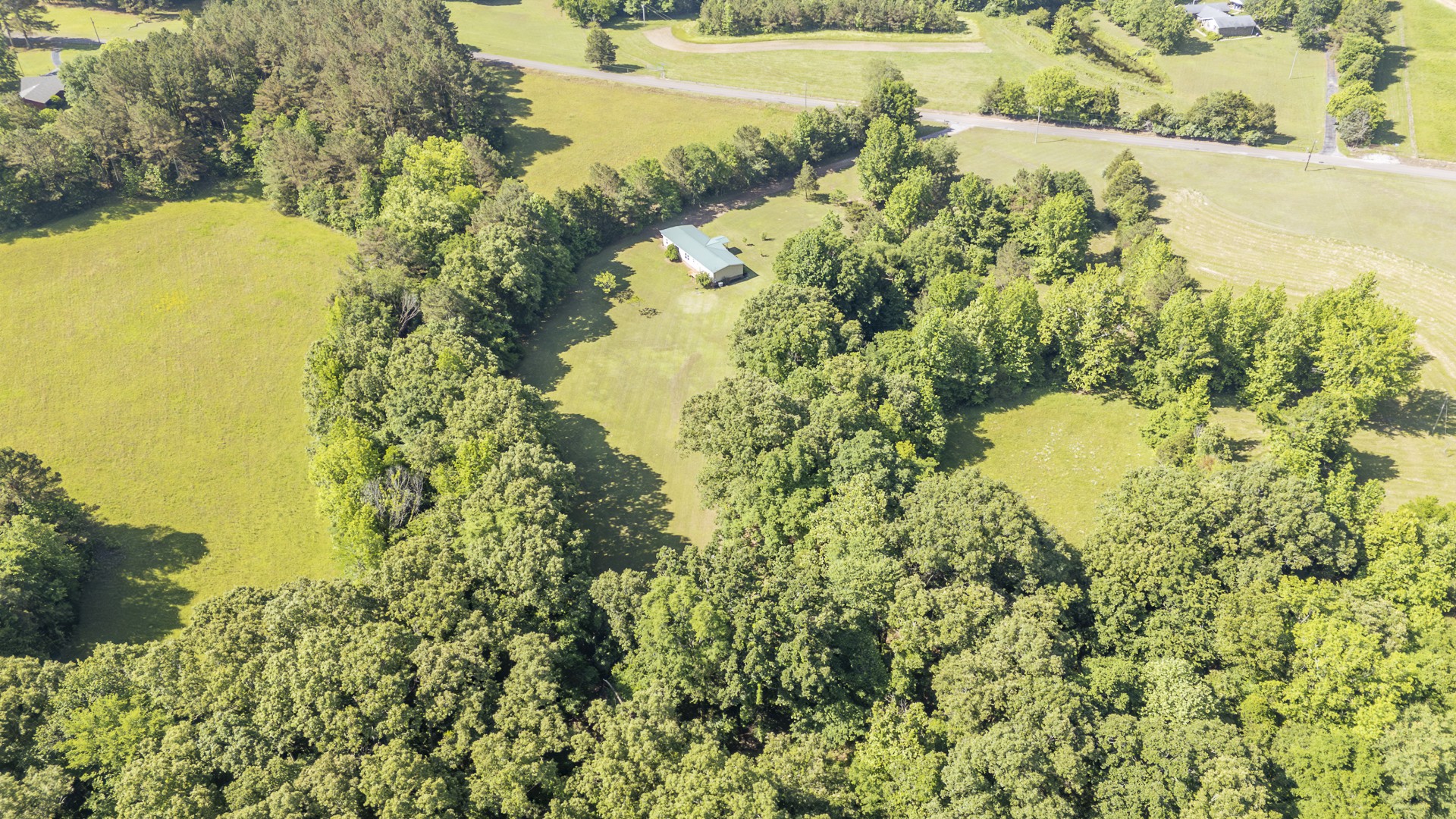 1125 Clifft Road Bolivar, TN 38008 - Photo 71 of 78 a view of a lake with a yard