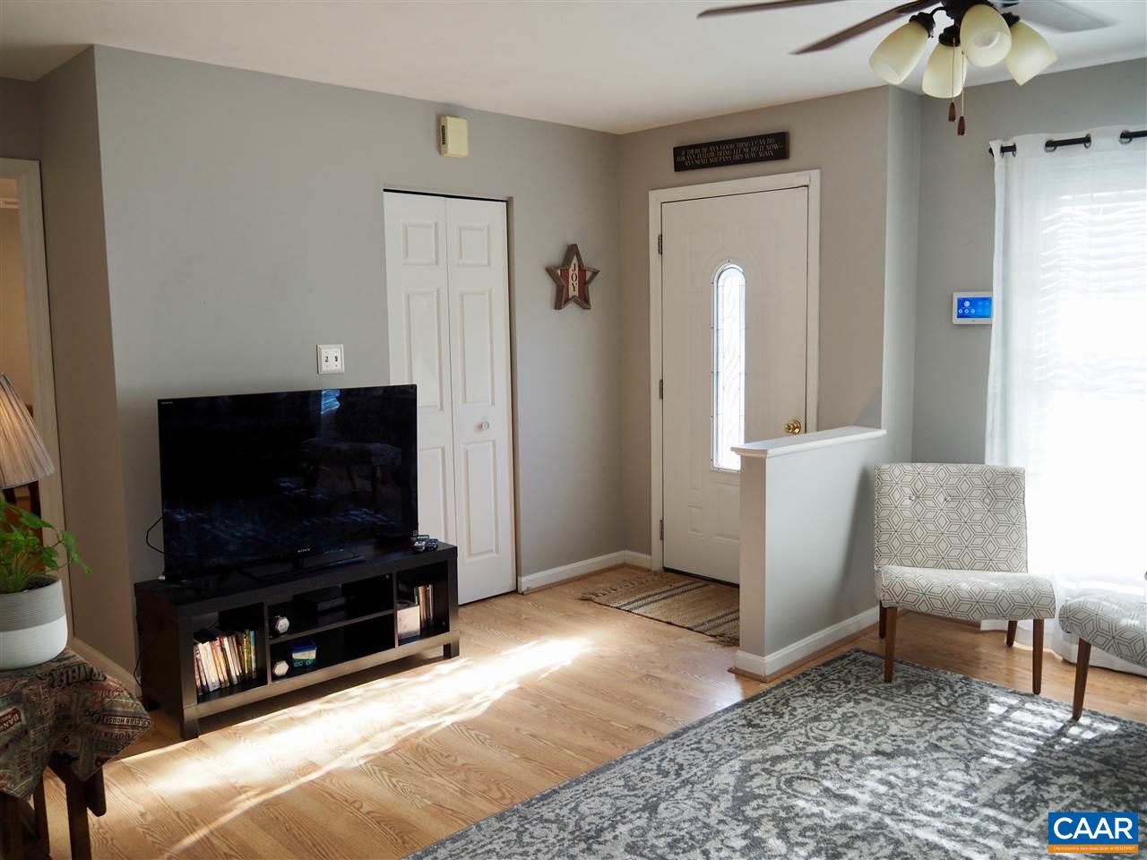 2880 Craigland Road Charlottesville, VA 22902 - Photo 5 of 48 a living room with furniture and a flat screen tv