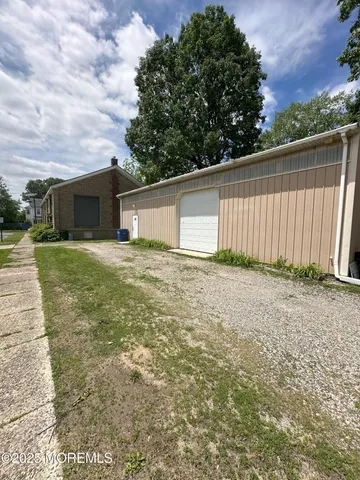 a view of a backyard of the house