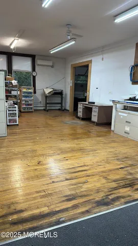 a large white kitchen with stainless steel appliances kitchen island a refrigerator sink and stove