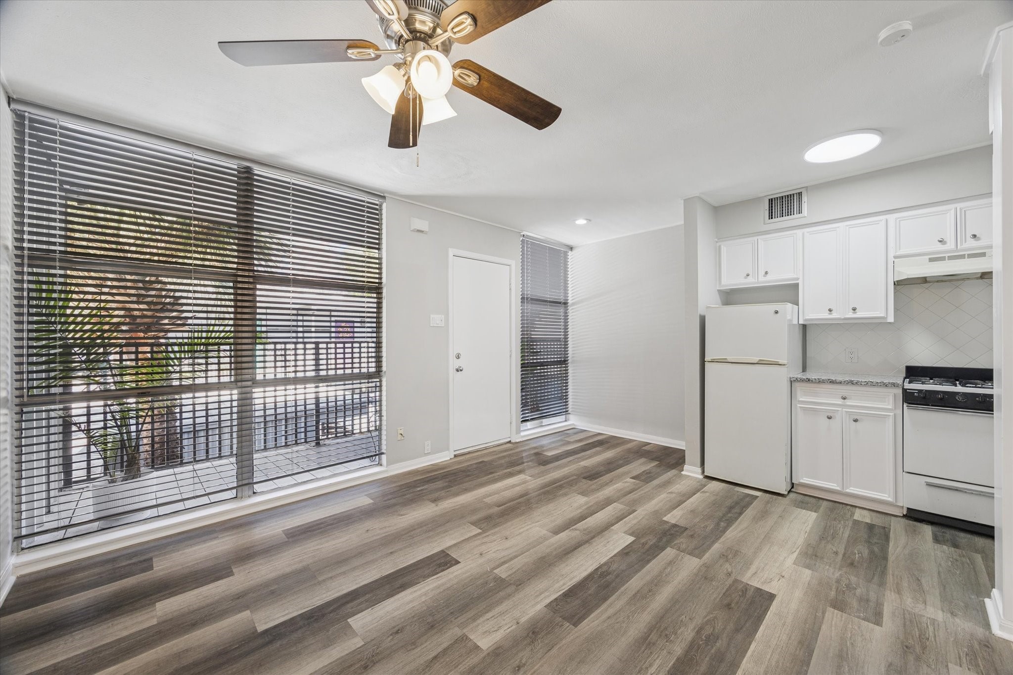 a view of a kitchen with a sink and dishwasher cabinets