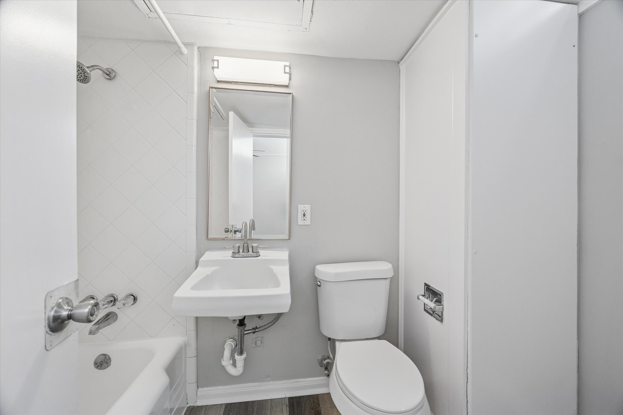 1901 Whitney Street, Unit 7 Houston, TX 77006 - Photo 7 of 10 a bathroom with a sink a toilet and shower