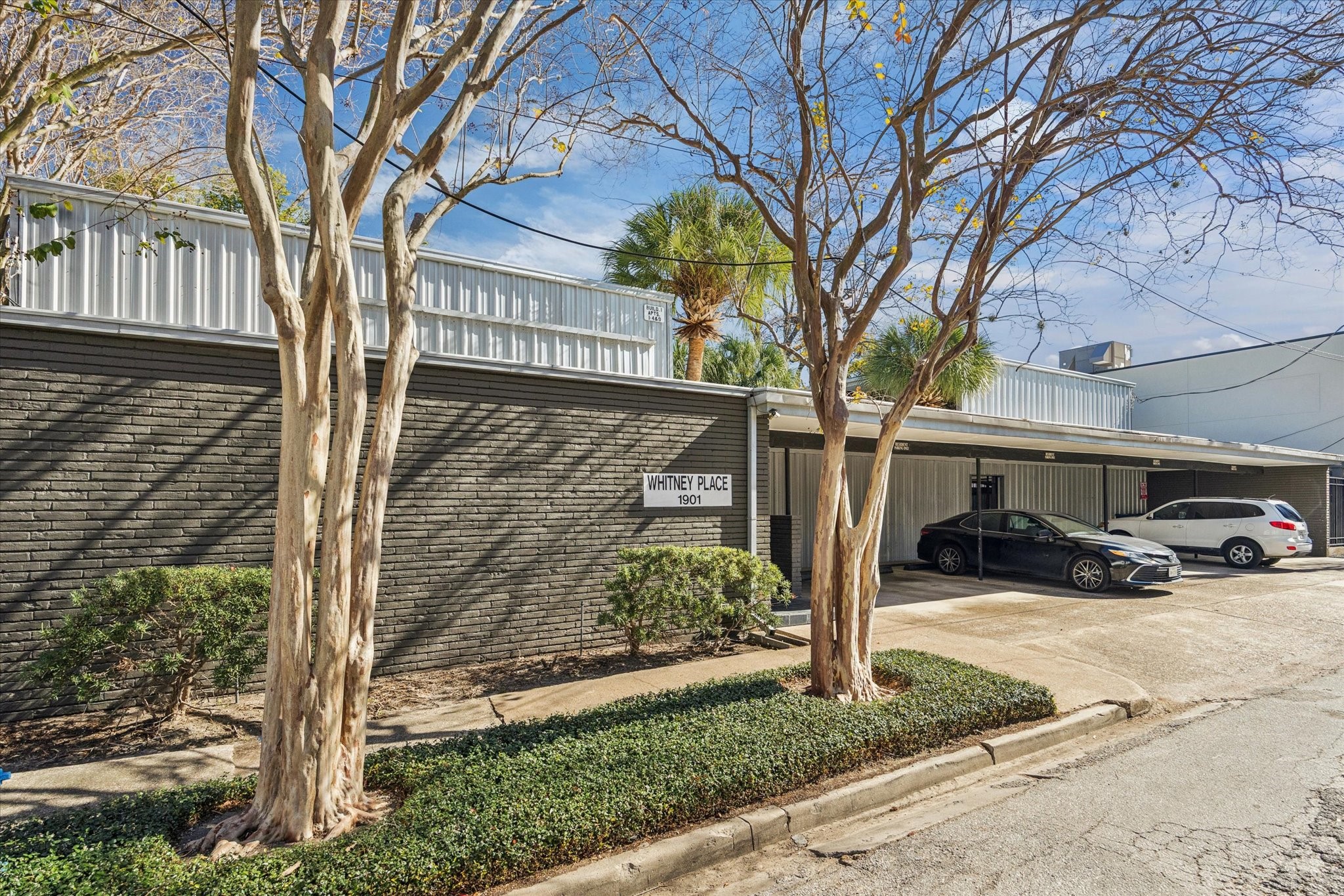 1901 Whitney Street, Unit 7 Houston, TX 77006 - Photo 10 of 10 a view of a car park in front of a house