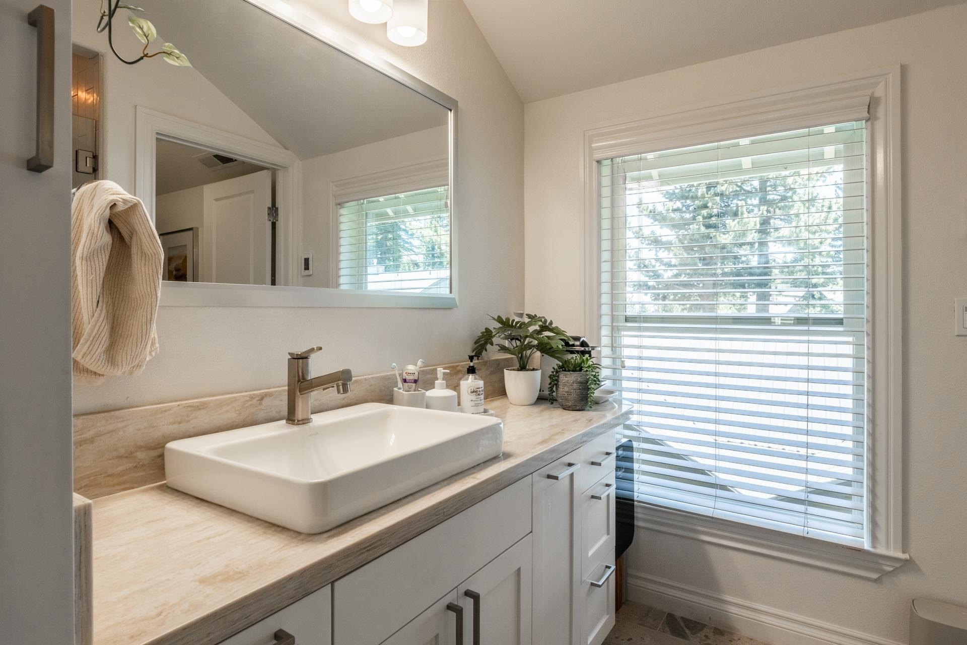 1787 Old Mammoth Road, Unit 2 Mammoth Lakes, CA 93546 - Photo 19 of 29 Bathroom vanity featuring a rectangular vessel sink, brushed nickel faucet, and a light-toned counte