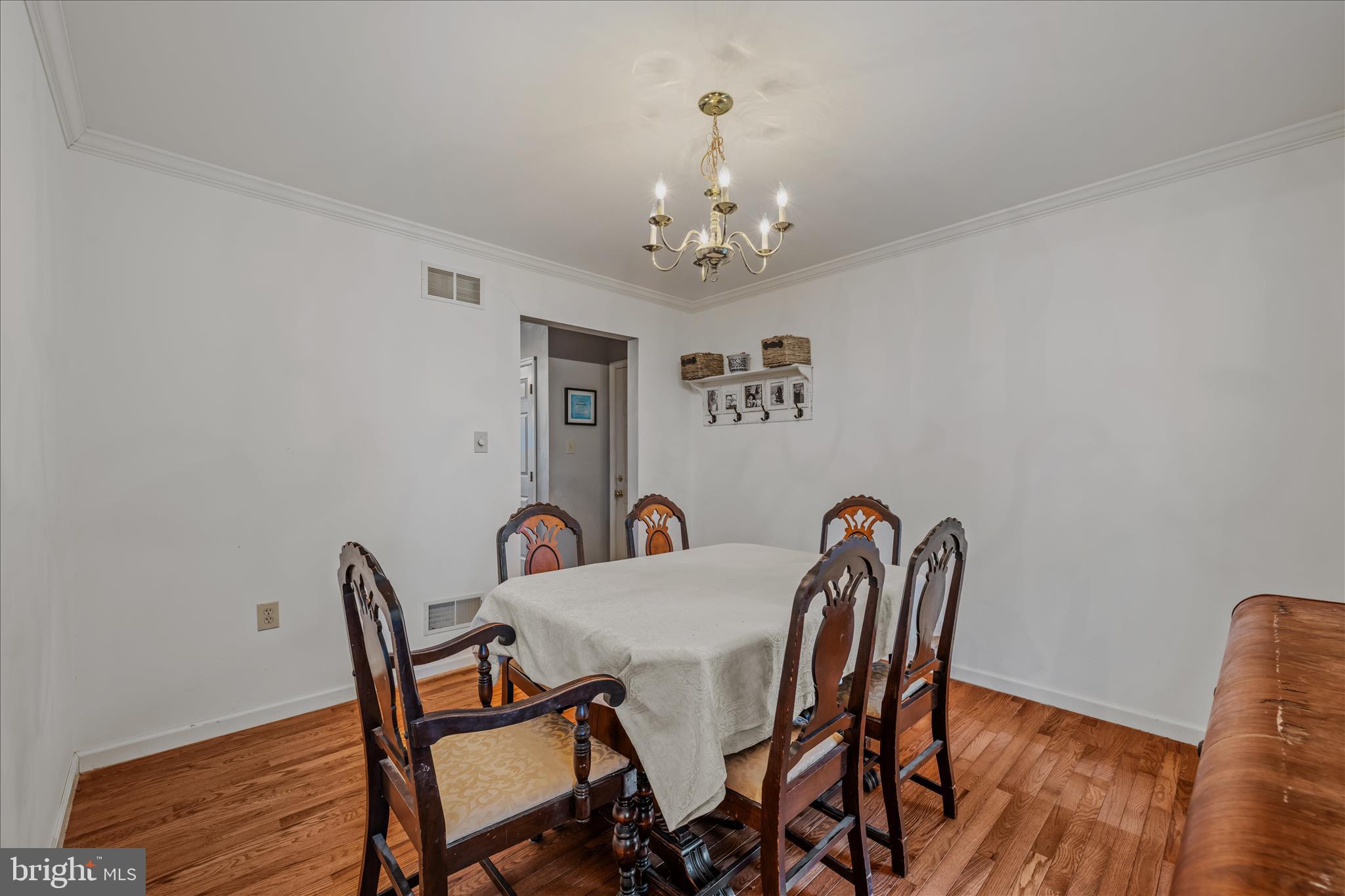 2509 Highland Ridge Road Berkeley Springs, WV 25411 - Photo 11 of 68 a view of a dining room with furniture and wooden floor