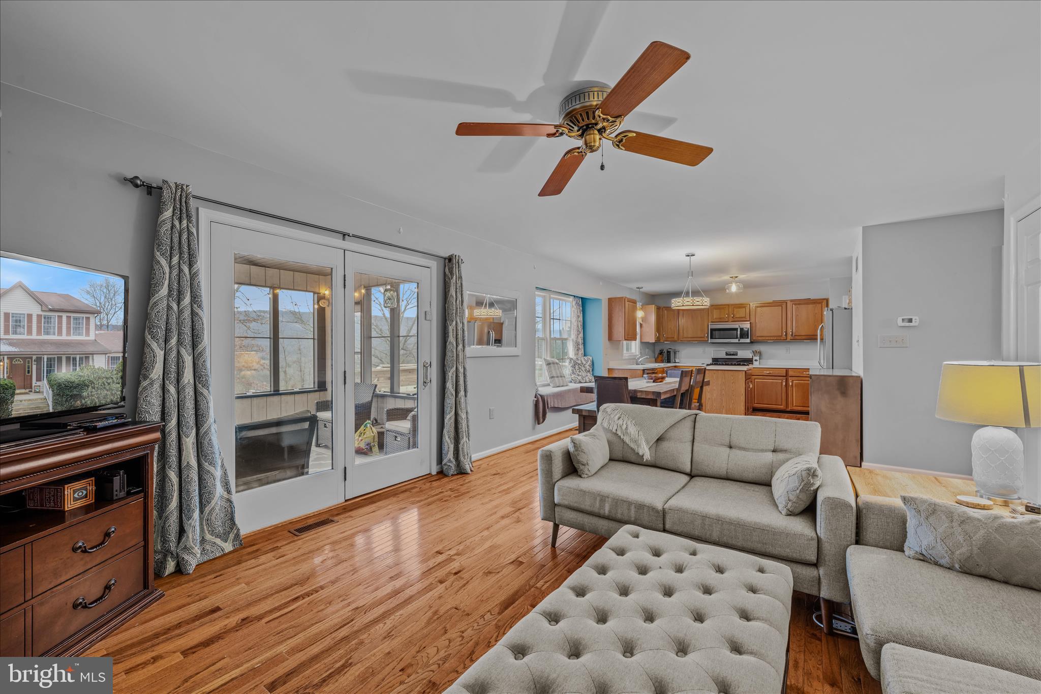 2509 Highland Ridge Road Berkeley Springs, WV 25411 - Photo 15 of 68 a living room with furniture and a flat screen tv