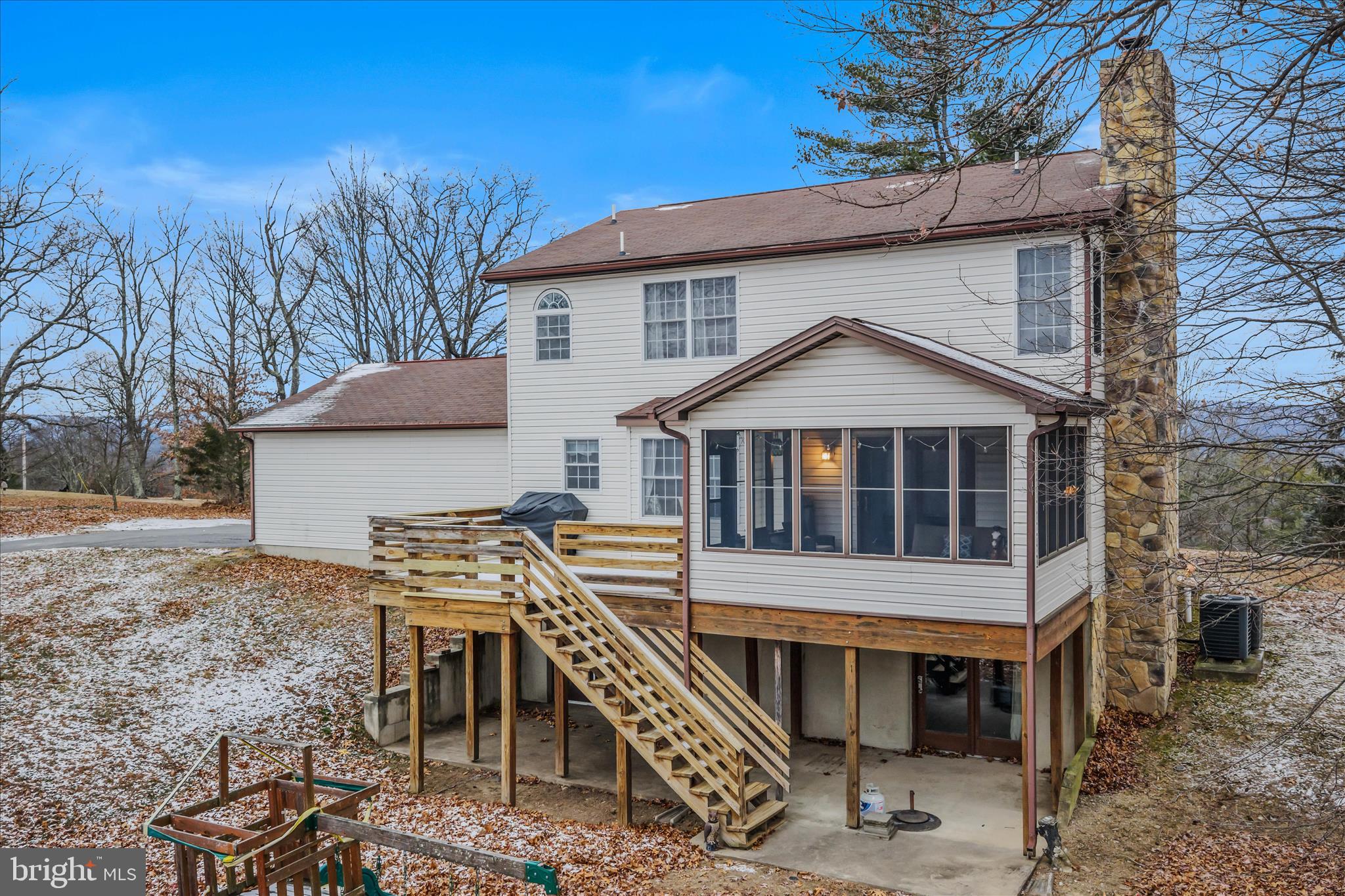 2509 Highland Ridge Road Berkeley Springs, WV 25411 - Photo 49 of 68 a front view of a house with a porch