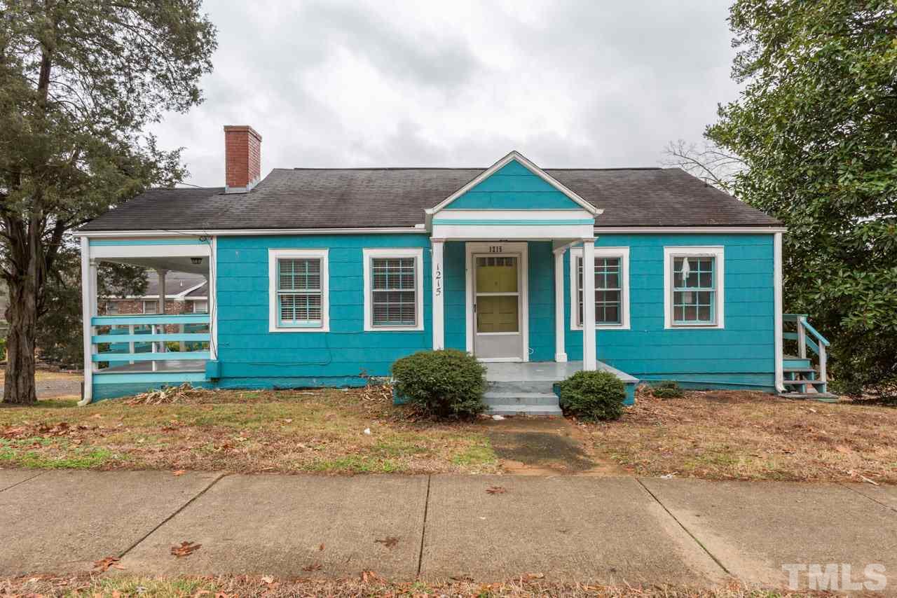 1215 Kent Road Raleigh, NC 27606 - Photo 1 of 11 a front view of a house with garden