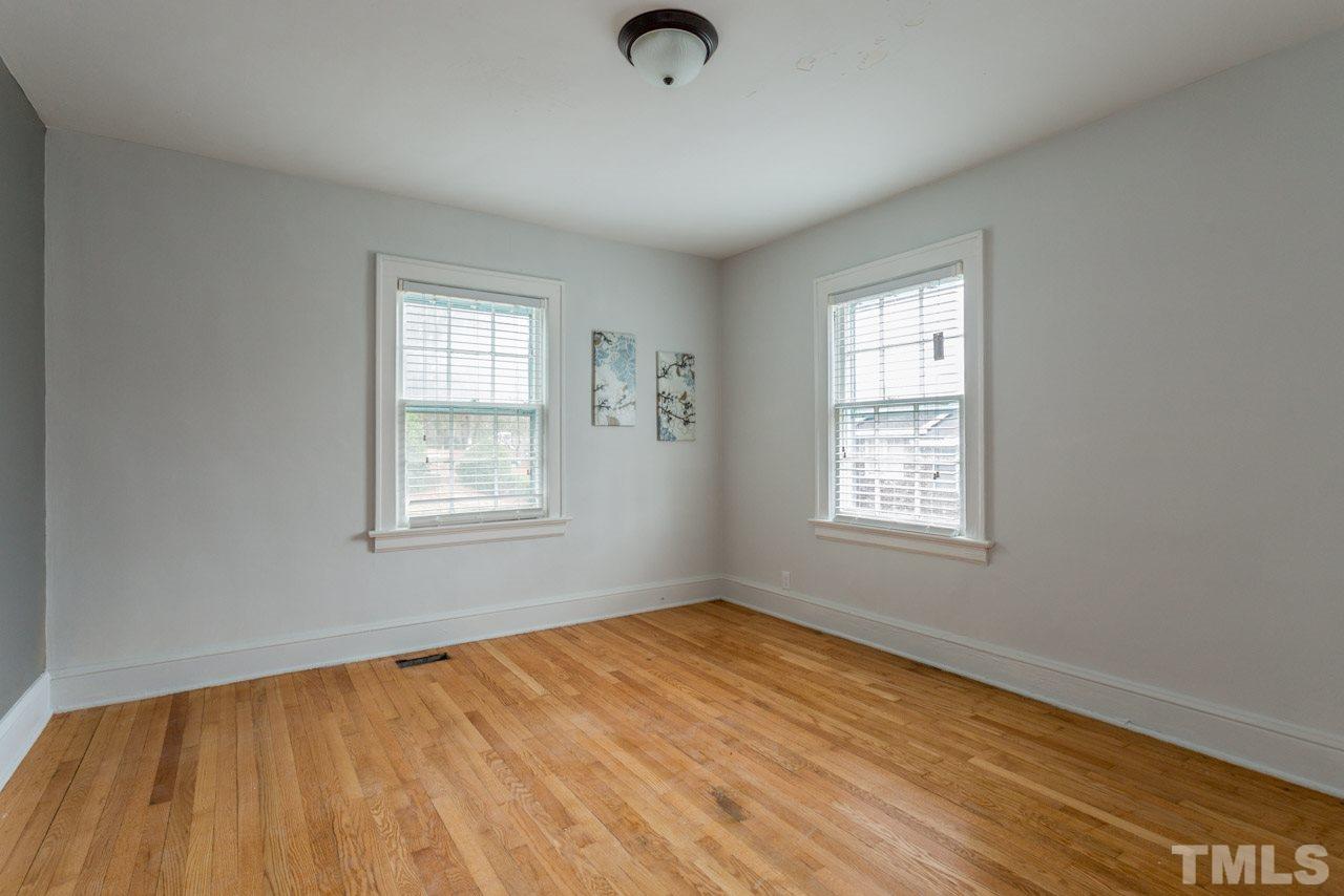 1215 Kent Road Raleigh, NC 27606 - Photo 7 of 11 wooden floor in an empty room with a window