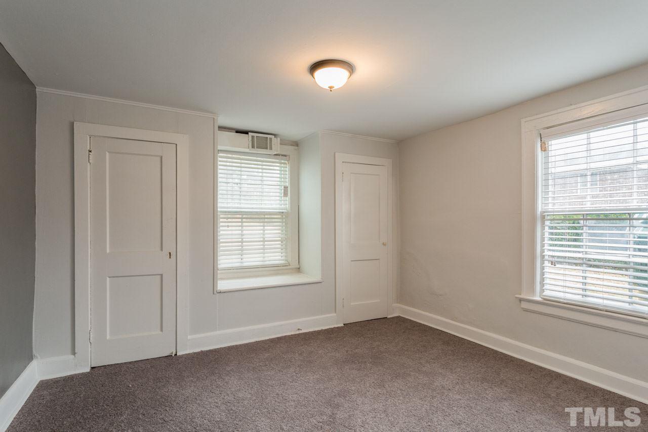 1215 Kent Road Raleigh, NC 27606 - Photo 8 of 11 an empty room with windows