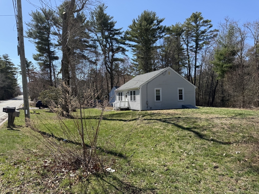 73 County Road Freetown, MA 02717 - Photo 8 of 11 a view of a house with backyard and tree