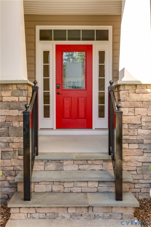 7538 South Franklins Way Quinton, VA 23141 - Photo 3 of 48 a front view of a house with a red door