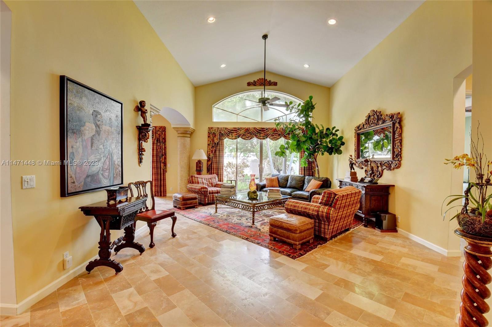 6325 Northwest 23rd Road Boca Raton, FL 33434 - Photo 22 of 84 a living room with furniture and a large window