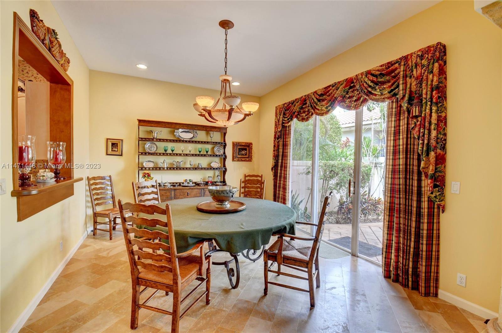 6325 Northwest 23rd Road Boca Raton, FL 33434 - Photo 29 of 84 a view of a dining room with furniture window and wooden floor