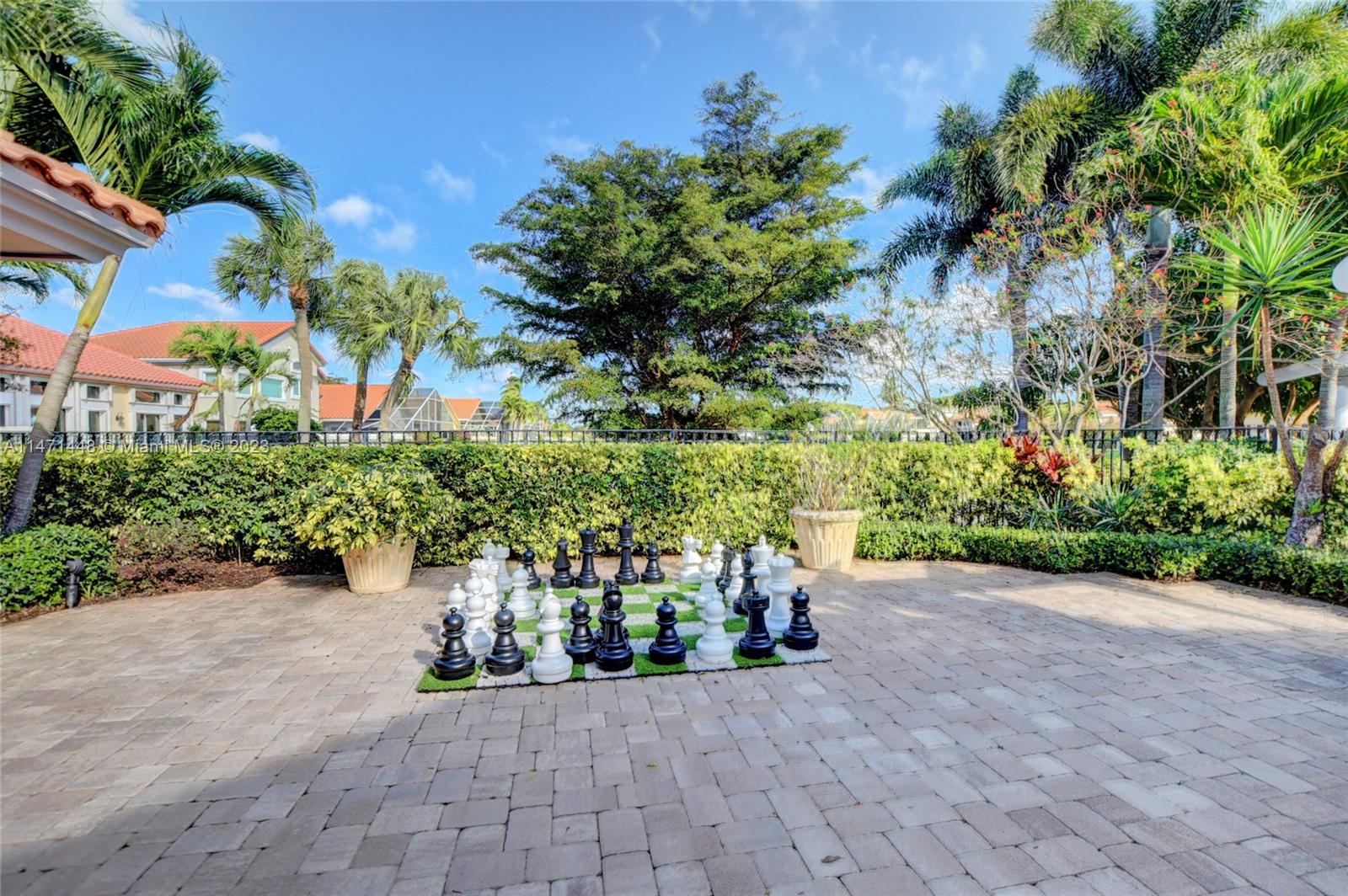 6325 Northwest 23rd Road Boca Raton, FL 33434 - Photo 76 of 84 a view of a garden with plants and a bench