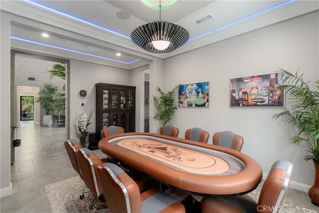 a large kitchen with kitchen island a large window in it