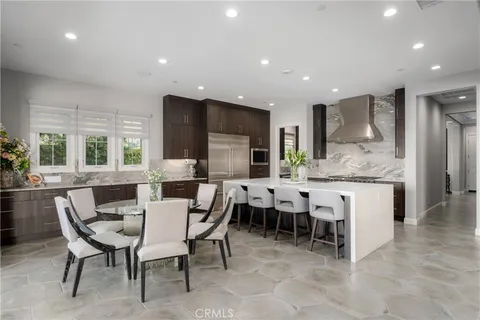 a kitchen with a sink and a refrigerator