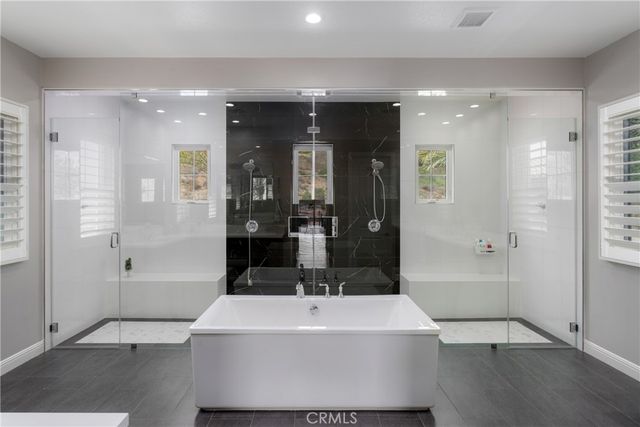 a large bathroom with a sink and a large mirror