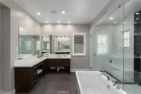 a living room with furniture a fireplace and a large window