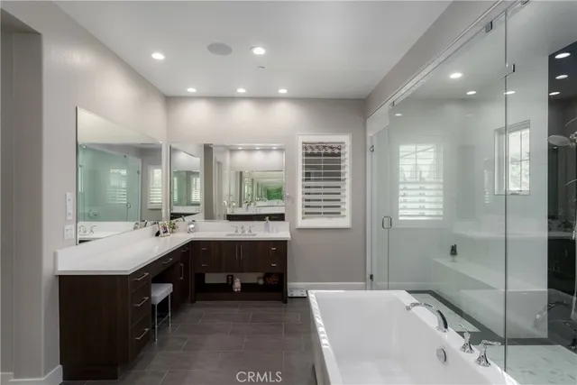 a living room with furniture a fireplace and a large window