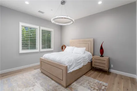 a bathroom with a sink vanity toilet and shower