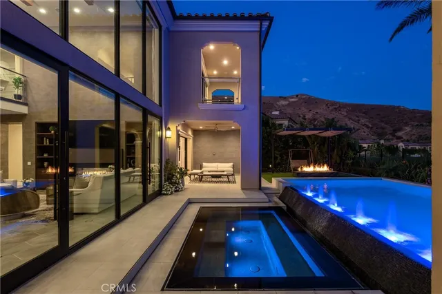 a swimming pool with yard in front of it