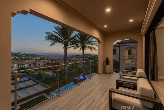 a view of a street with potted plants