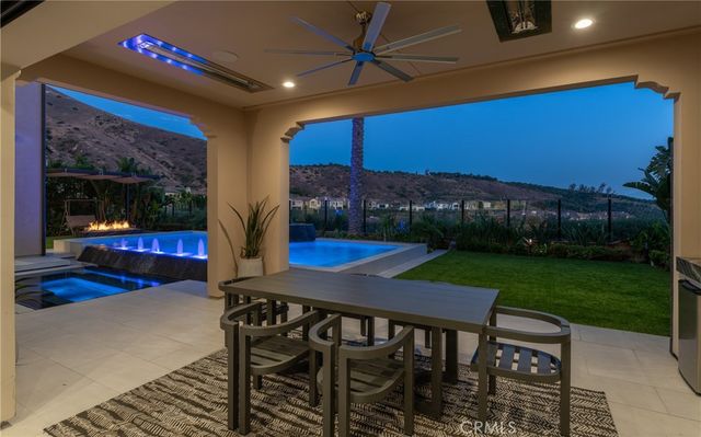 a view of a chairs and table in patio