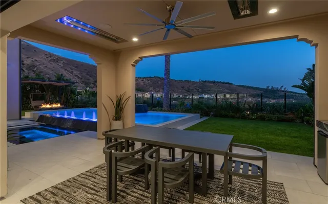 a view of a chairs and table in patio