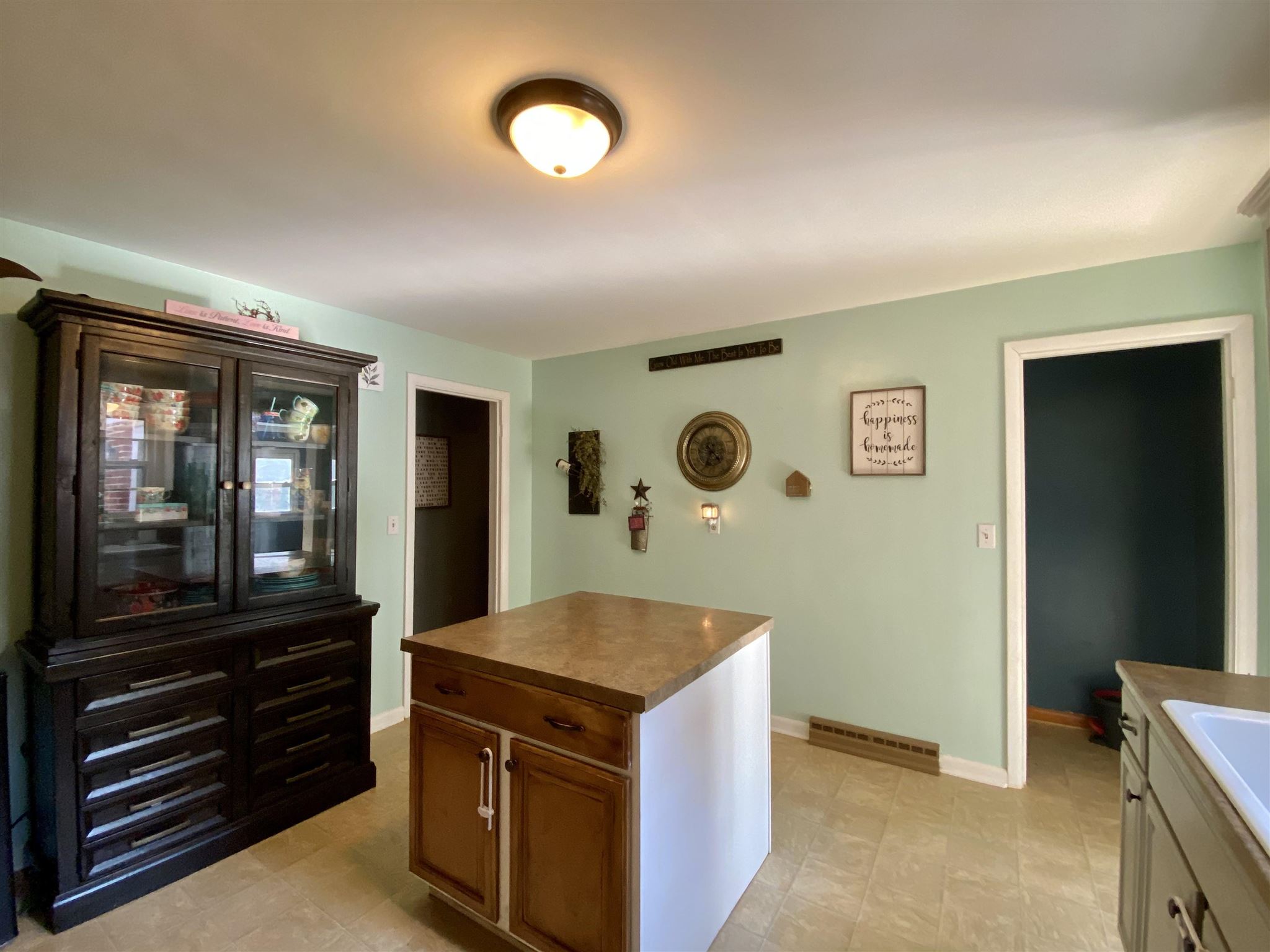 116 Robinhood Road Staunton, VA 24401 - Photo 9 of 34 a view of kitchen cabinets and wooden floor