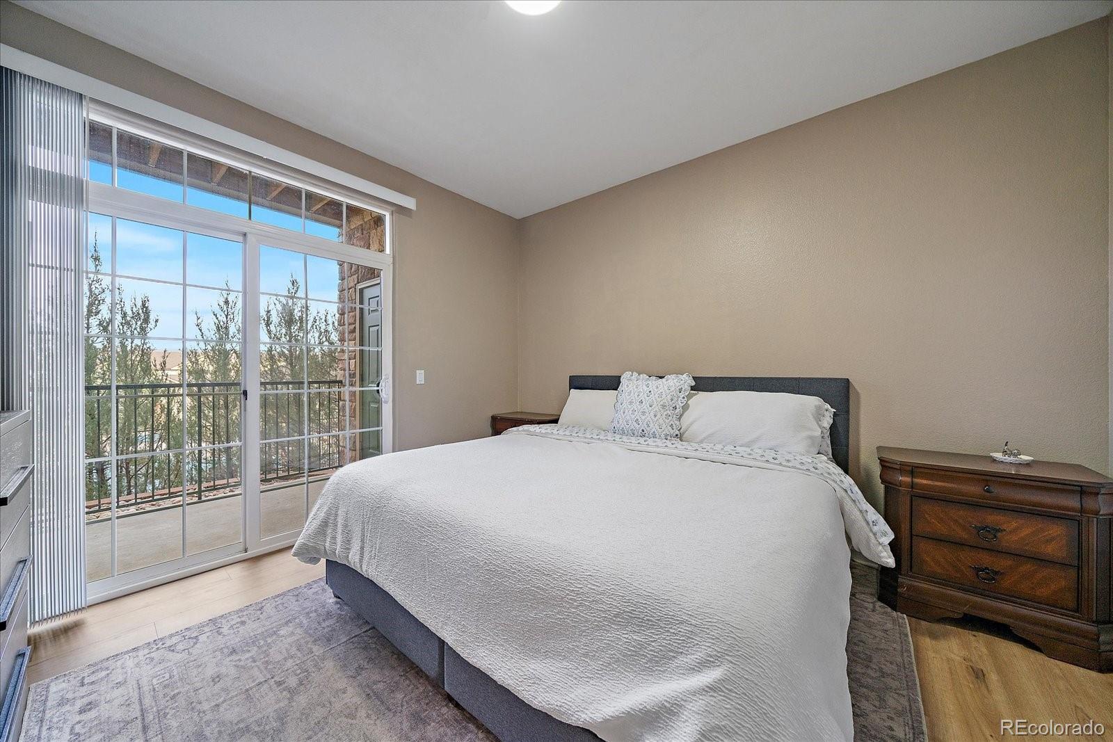 18611 Stroh Road, Unit 5102 Parker, CO 80134 - Photo 12 of 21 a large bed sitting in a bedroom next to a window