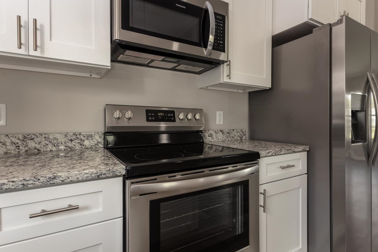 17030 Mt Pleasant Road Elkton, VA 22827 - Photo 11 of 22 a stove top oven sitting inside of a kitchen