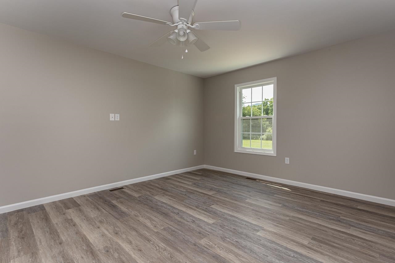 17030 Mt Pleasant Road Elkton, VA 22827 - Photo 12 of 22 wooden floor in an empty room with a window