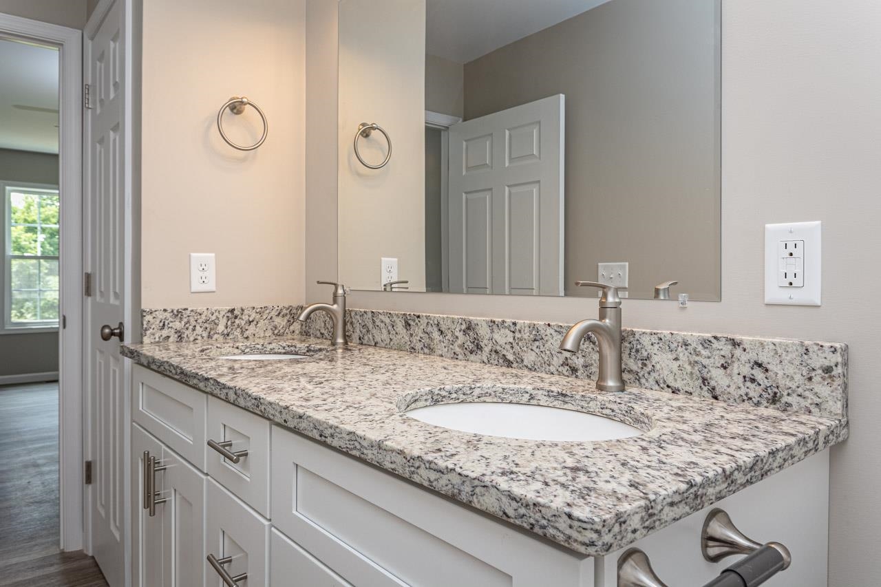17030 Mt Pleasant Road Elkton, VA 22827 - Photo 15 of 22 a bathroom with a granite countertop sink and a mirror