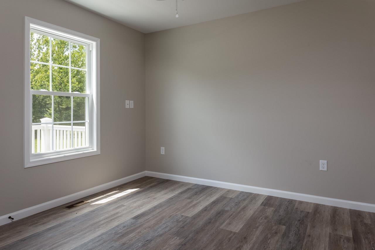 17030 Mt Pleasant Road Elkton, VA 22827 - Photo 16 of 22 an empty room with wooden floor and windows