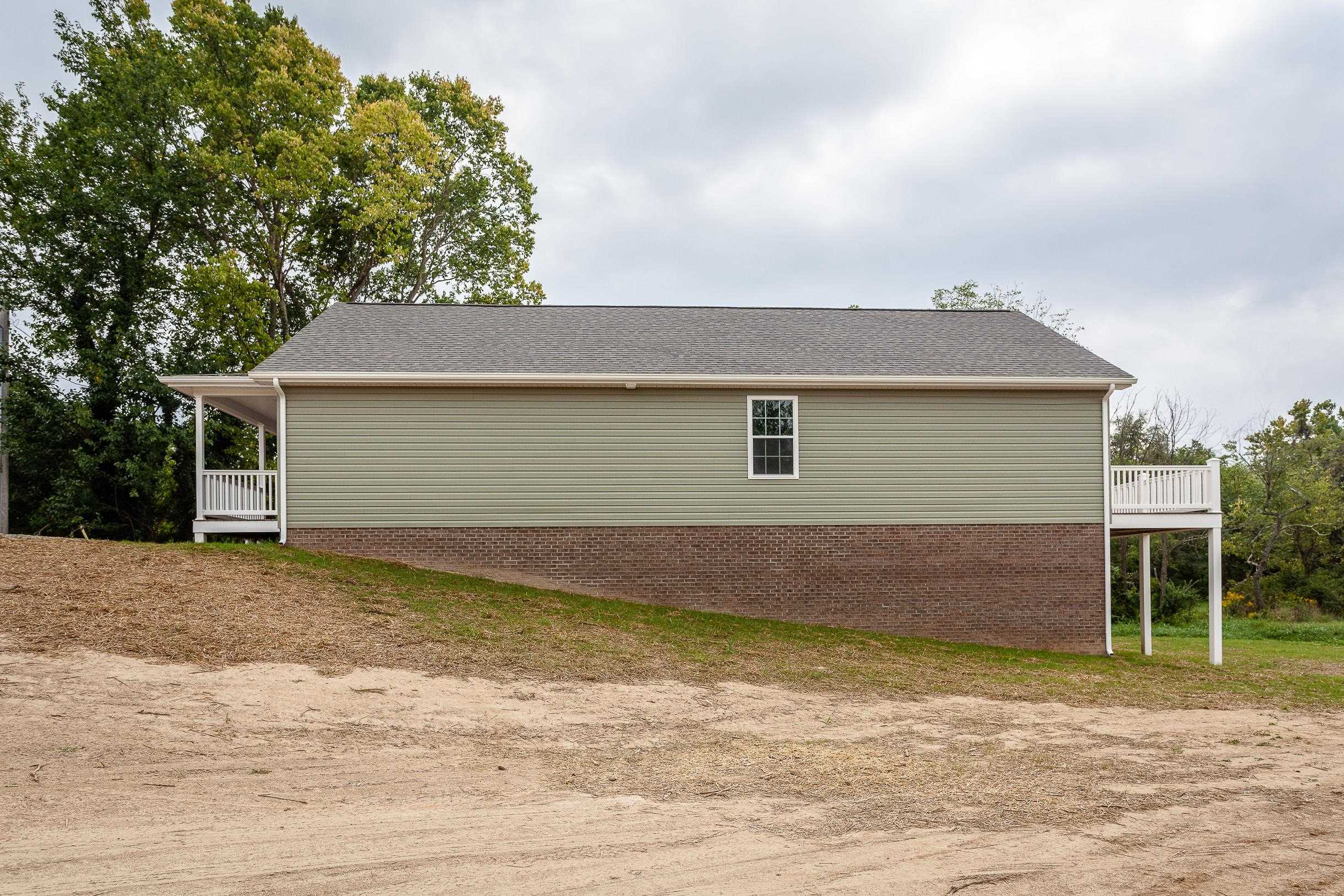 17030 Mt Pleasant Road Elkton, VA 22827 - Photo 21 of 22 a front view of a house with a yard