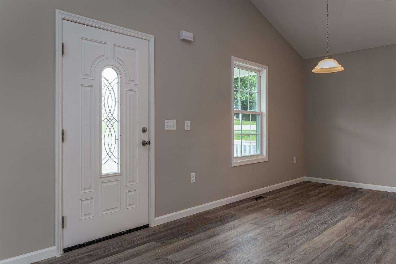 17030 Mt Pleasant Road Elkton, VA 22827 - Photo 4 of 22 an empty room with wooden floor and windows