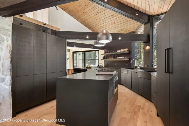 a kitchen with refrigerator and window