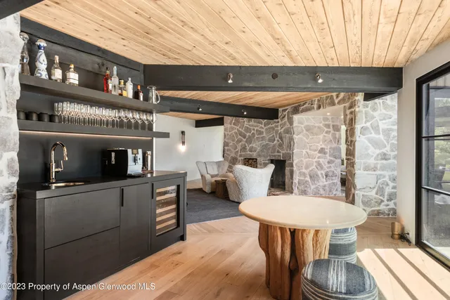 a kitchen view with table and chairs