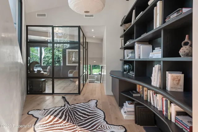 a view of a living room and a wooden floor