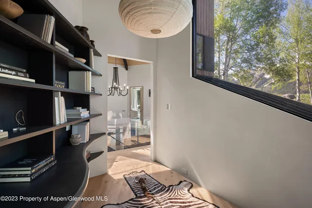 a bedroom with a bed and a mirror