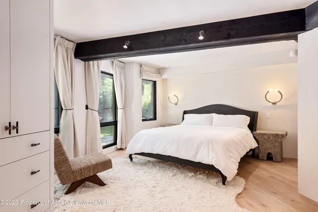 a bathroom with a toilet sink and shower