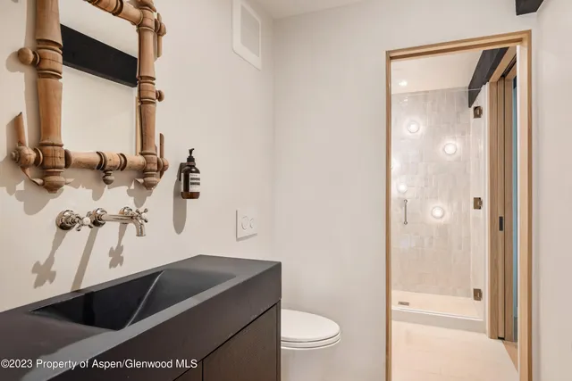 a bedroom with a bed and a table