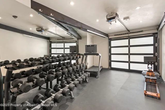 a hallway with a sink and a washer dryer
