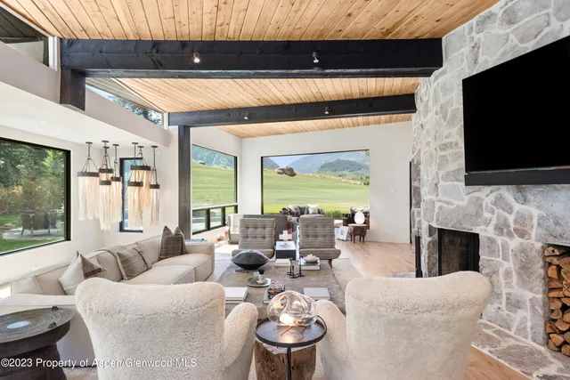 a living room with furniture fireplace and a flat screen tv